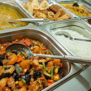 Indian lunch buffet or catering table with choice of vegetarian and non-vegetarian meals